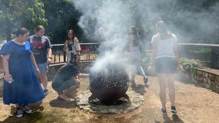 Students participating in smoking ceremony