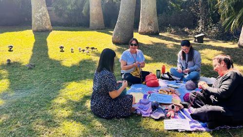 UOW staff crochet group making items for charity