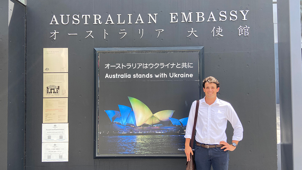 Carlo Teodorowych, a final-year UOW Bachelor of Laws student stands in front of the Australian Embassy