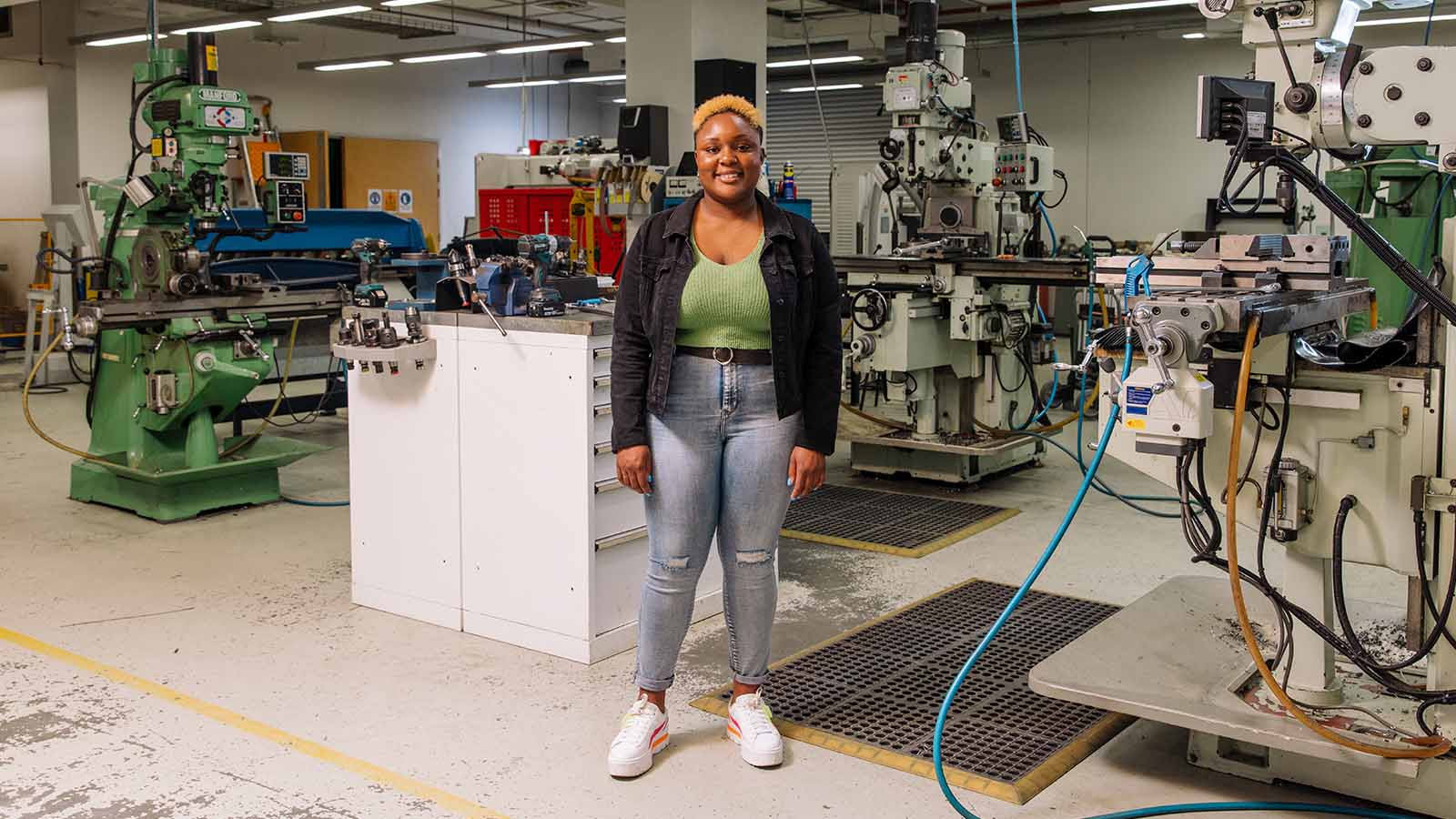 UOW engineering student Tapuwa Shambira standing in engineering workshop.