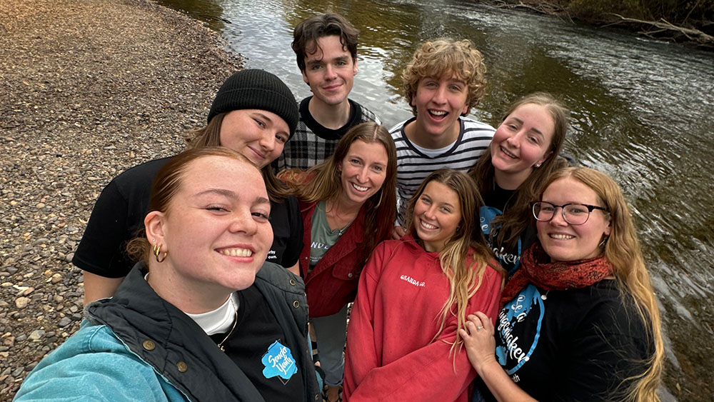 A group of teenagers smiling at the camera