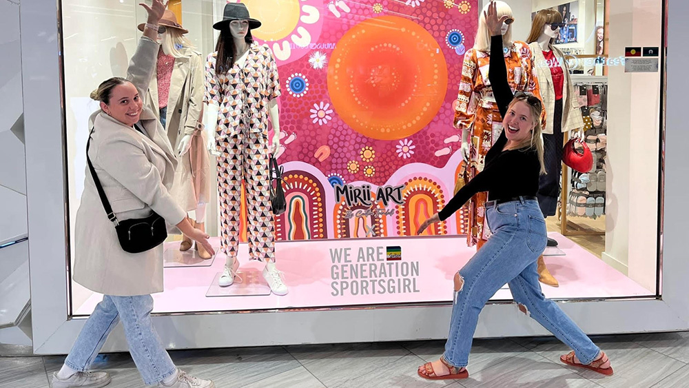 UOW graduate and Indigenous artist, Caitlin Trindall outside Sportsgirl Miranda shopfront