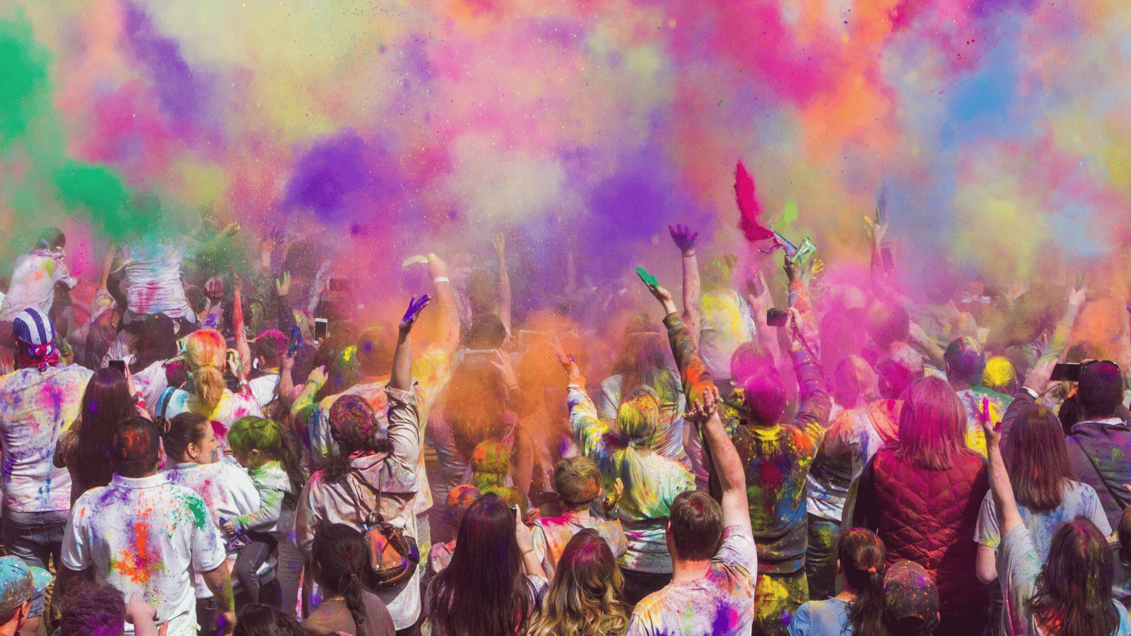 A group of young people celebrating Holi, the festival of colour