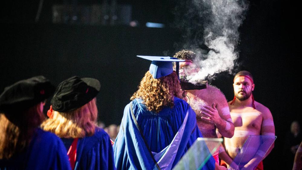 UOW students at graduation smoking ceremony