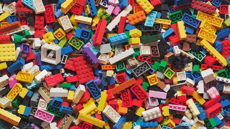 Large pile of different coloured LEGO pieces.