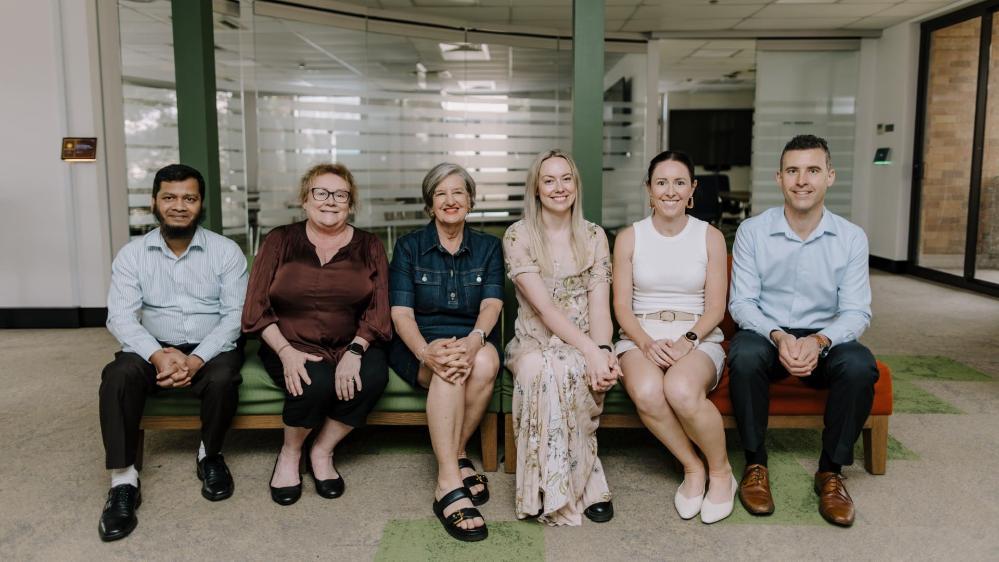 Dr Abdullah Al Mamun, Mrs Taryn McDonnell, Professor Lee Moerman, Dr Erin Twyford, Associate Professor Stephanie Perkiss, Mr Scott Snaidero sit on a lounge in the business faculty. Photo: Michael Gray