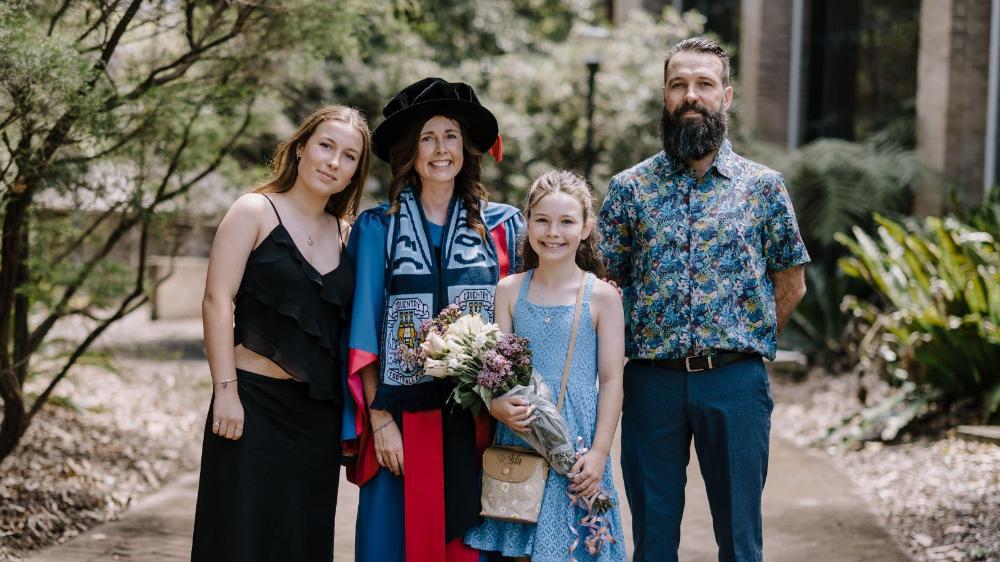 Dr Catherine Stephen with her daughter Molly, Isla and husband Paul. Dr Stephen is proudly wearing her Coventry City football scarf.