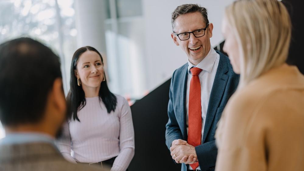 Finance Minister Stephen Jones talks with Associate Professor Stephanie Perkiss. Photo: Michael Gray