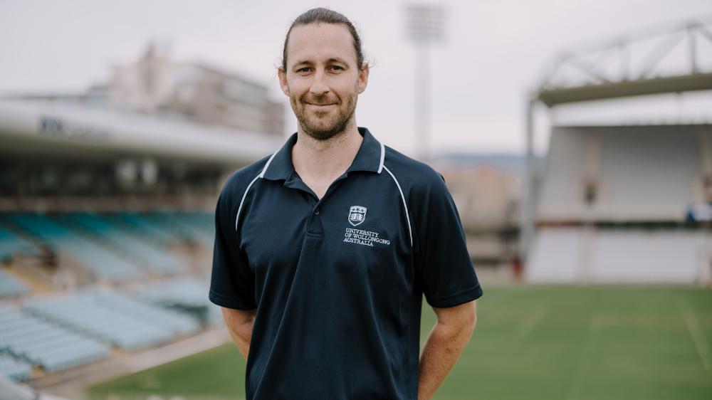 Dr Michael Macartney stands with WIN Stadium in the background. Photo: Michael Gray